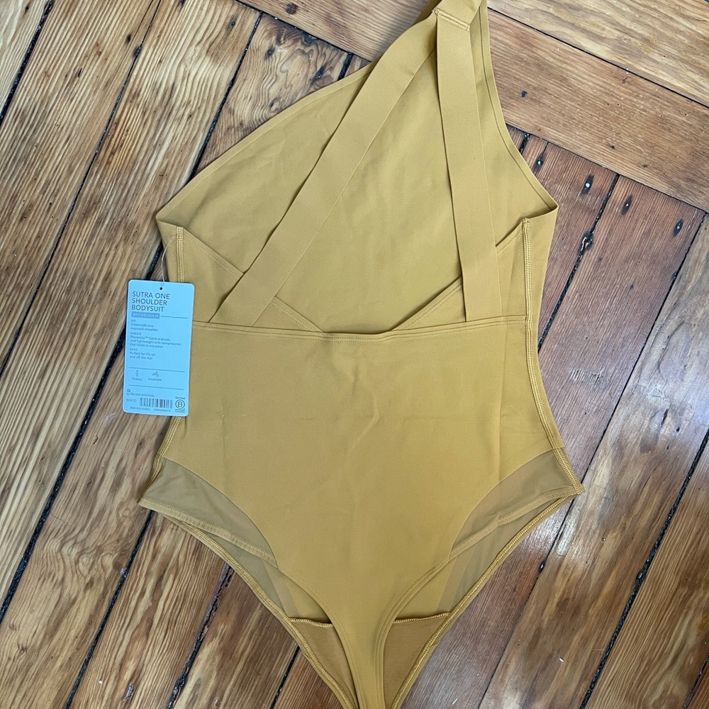 Brand new mustard athleta body suit